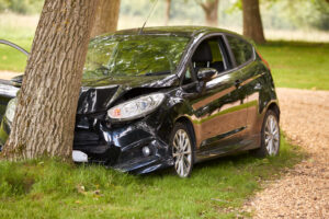 car crashed into a tree from a distracted driver in Marietta, GA