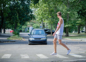 a driver about to hit a pedestrian crossing the road