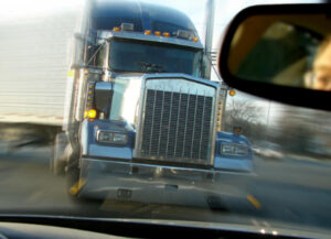 a semi truck about to cause car accidents. Victim will need to call a truck accident lawyer in Tucker, GA