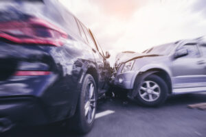 two damaged cars with injured victims inside