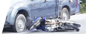 a damaged motorcycle against a car