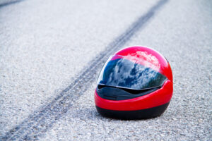 an accident with a motorcycle. traffic accident and skid marks on road. symbol photo.
